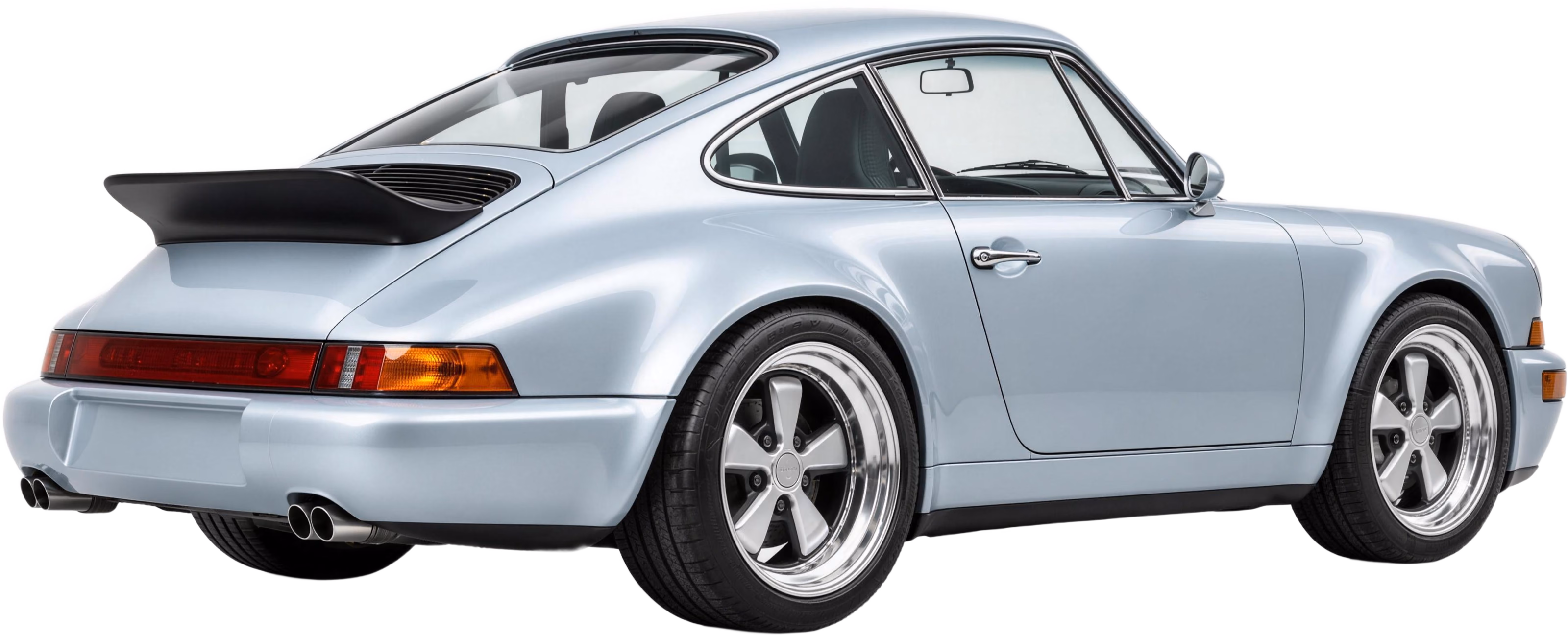 Silver-blue Porsche 911 with a black ducktail spoiler, seen from the rear three-quarter